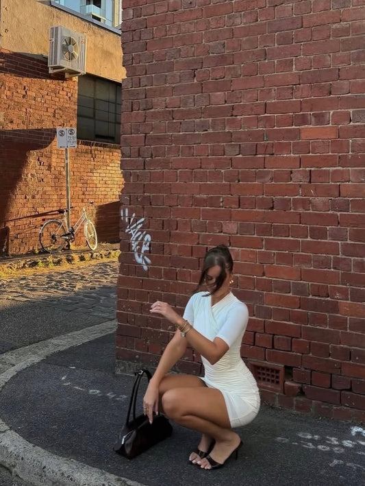 Kookai Benny Mini Dress Coconut Milk available for hire at The Label Hire. 